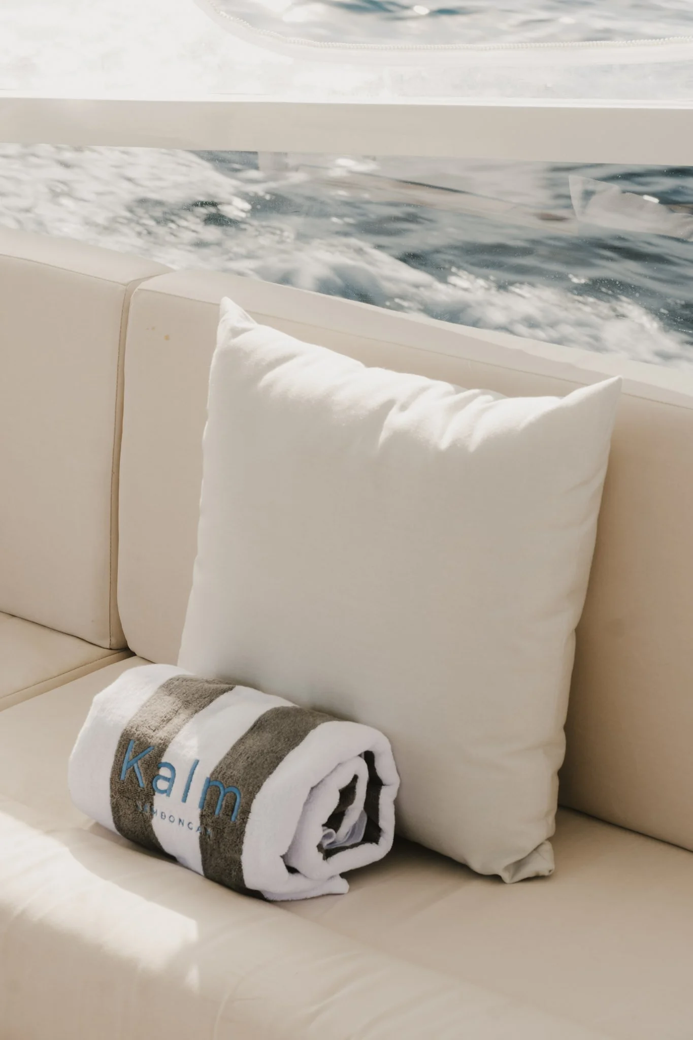 Interior lounge with ocean views aboard the Kalm Charters vessel.