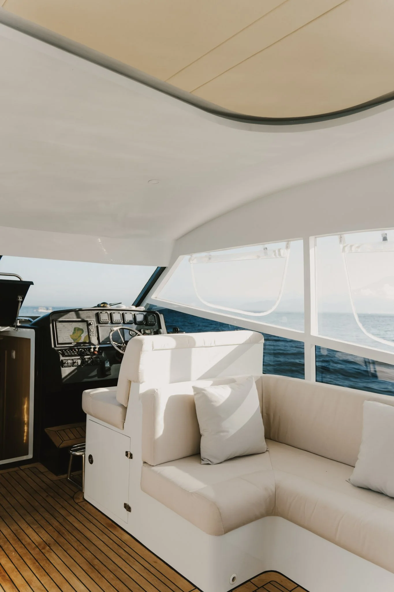 Captain's helm station and navigation controls aboard the Kalm Charters vessel.