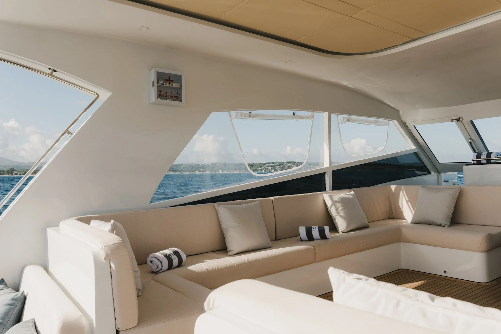 Interior lounge with ocean views aboard the Kalm Charters vessel.