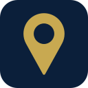 A gold location pin icon on a dark blue circular background.