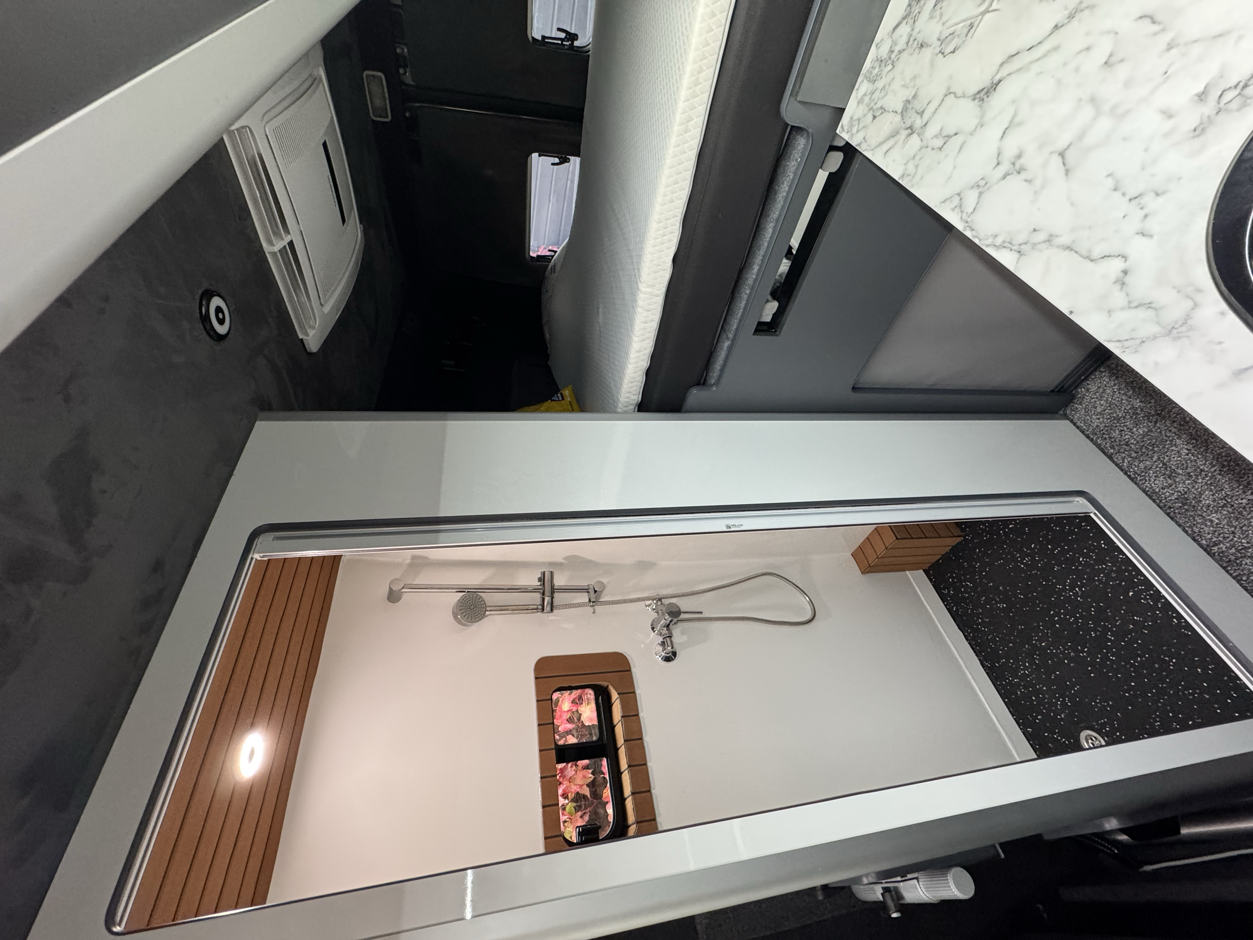 Retrofit full shower, hot & cold running high pressure water system, underslung water tanks.
