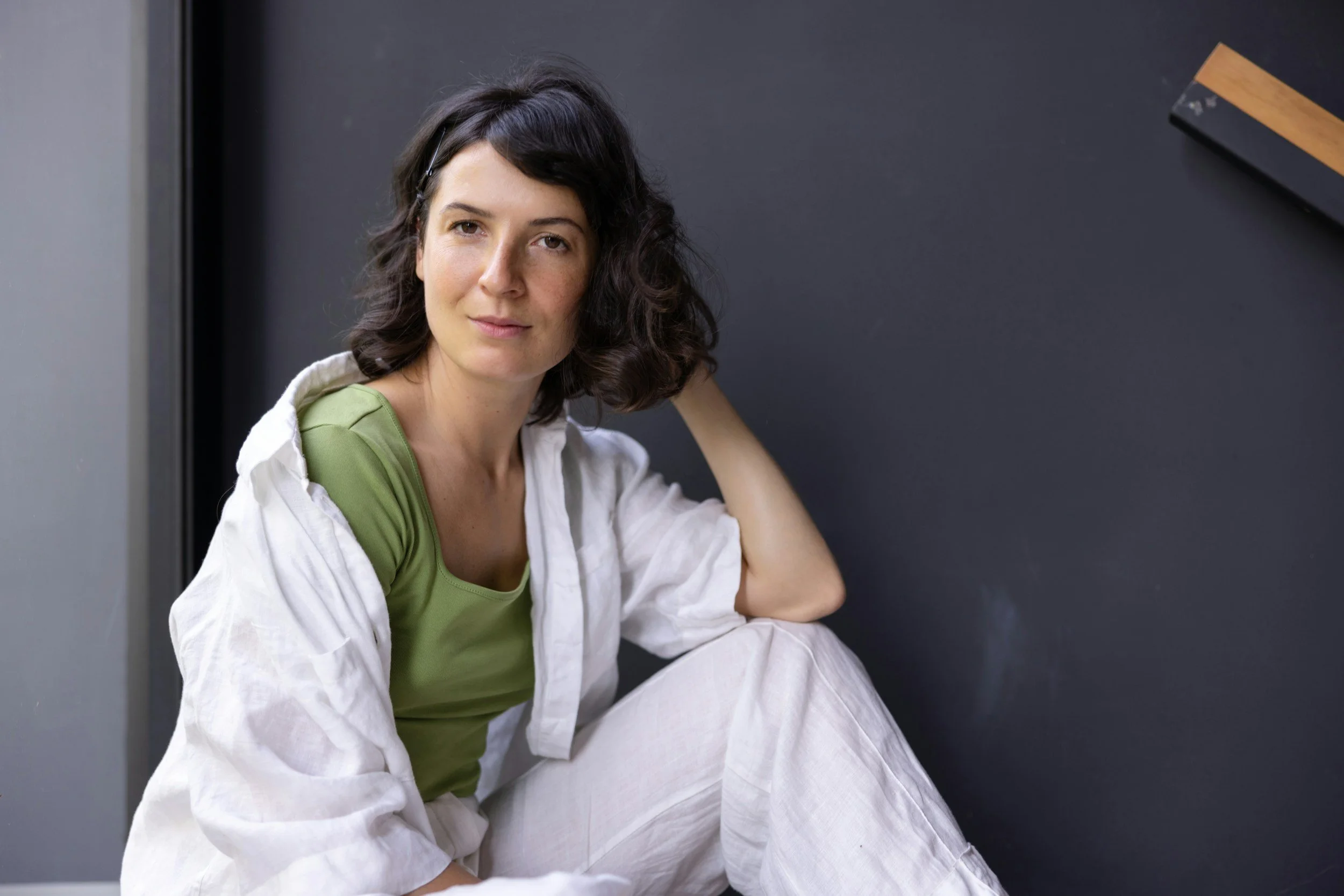 Woman sitting peacefully with morning tea, illustrating the quiet mind after stopping smoking for good