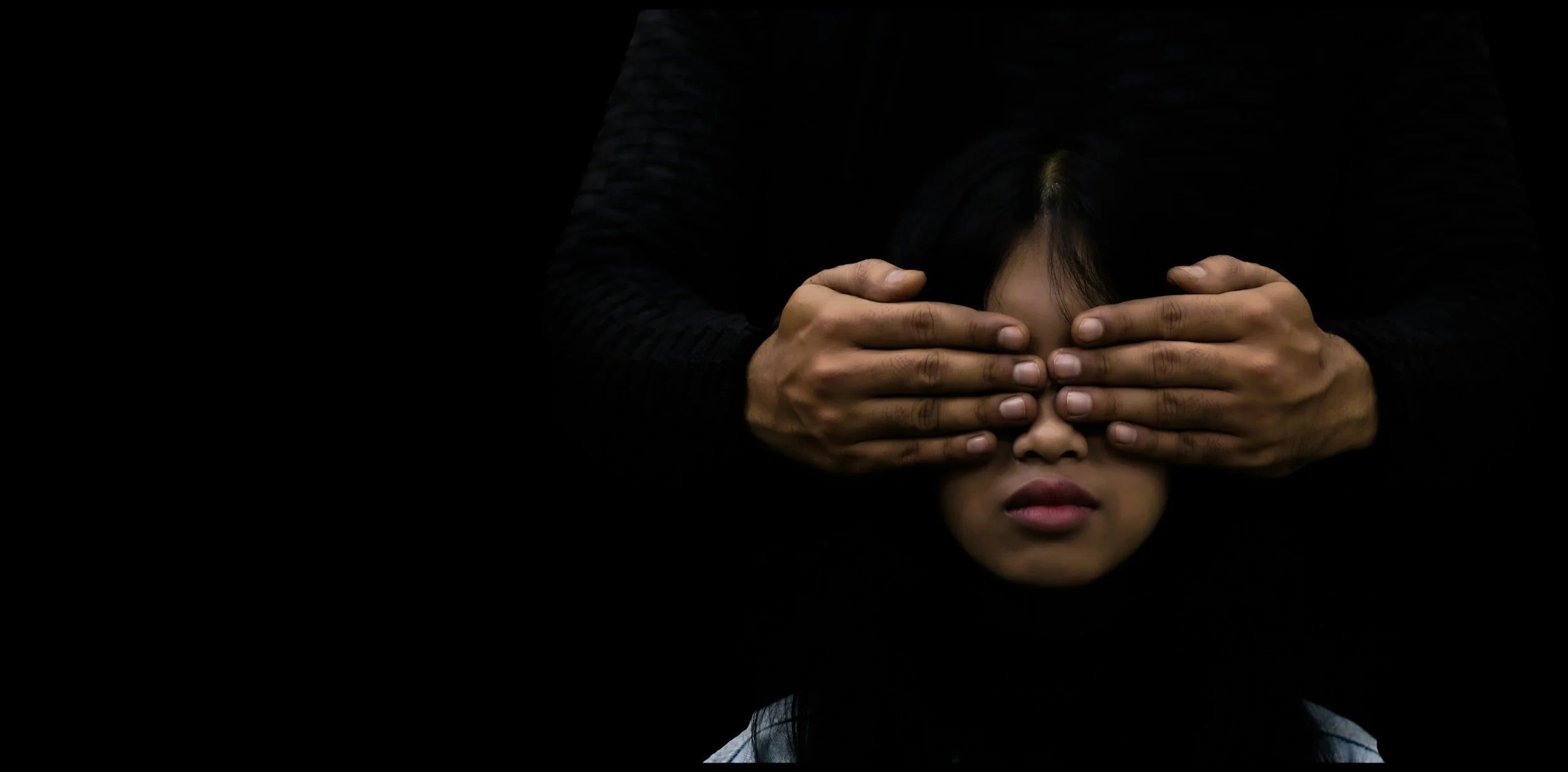 Woman with hands covering her eyes, representing the suppressed emotions that smoking has been keeping down for years.