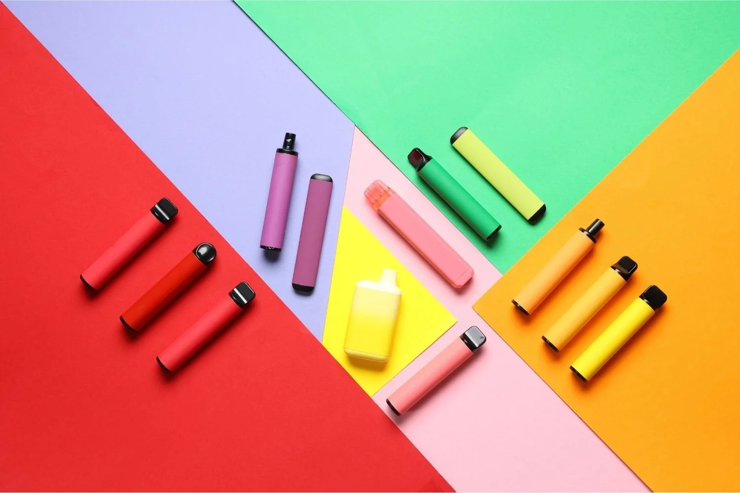 Colourful disposable vape devices on a bright background illustrating how vape marketing keeps women trapped on vaping
