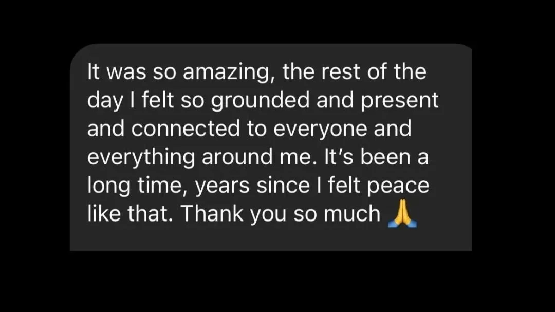A screenshot of a message on a black background expressing feelings of peace, grounding, and gratitude, with a prayer hands emoji at the end.