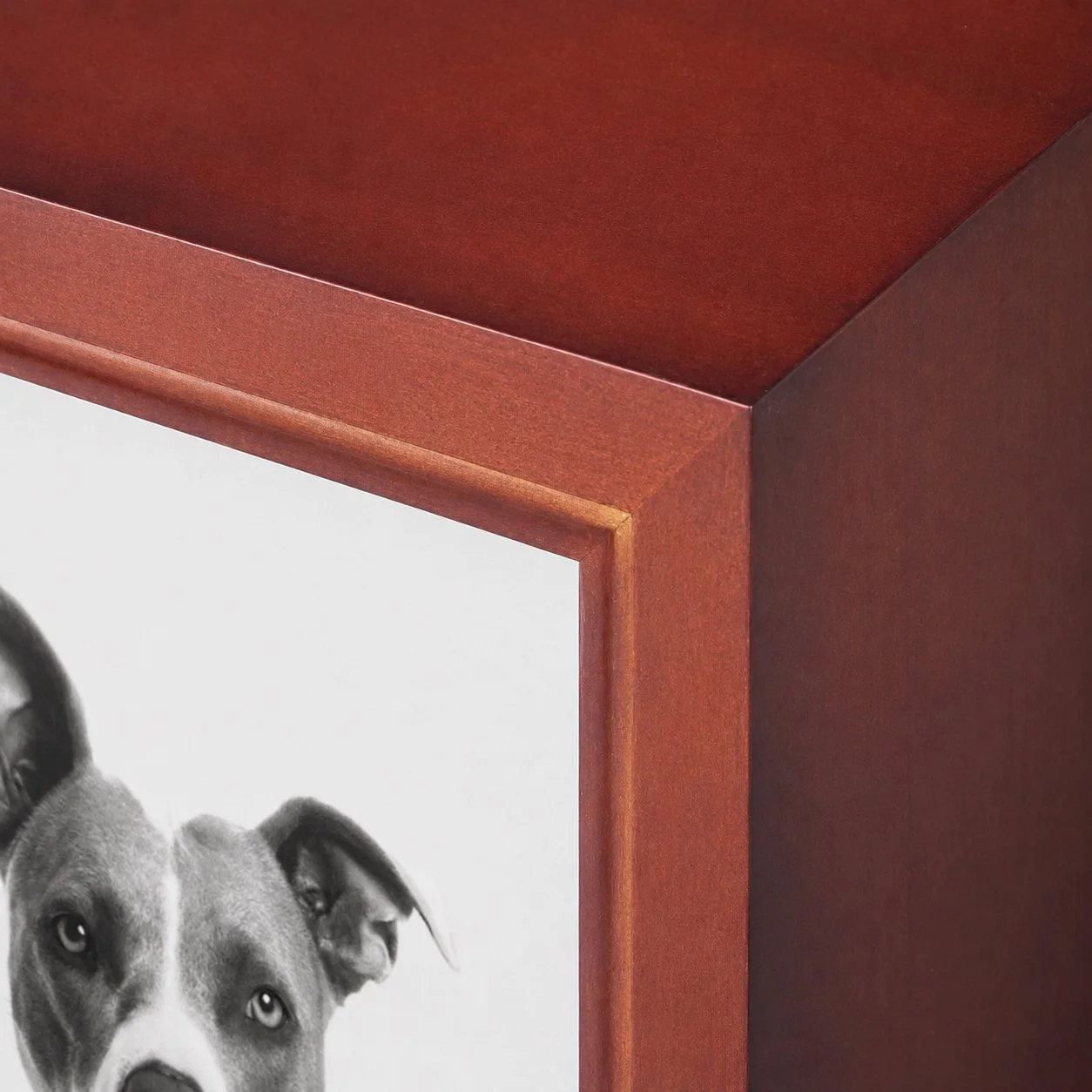 Close-up of wooden photo memorial urn showing timber finish and craftsmanship