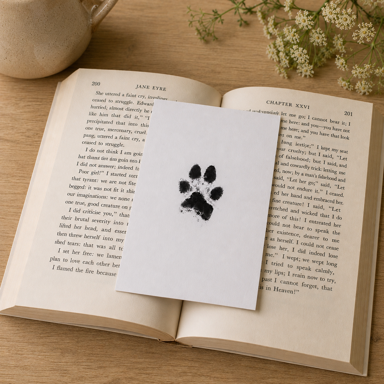 Pet ink paw print keepsake displayed on an open book