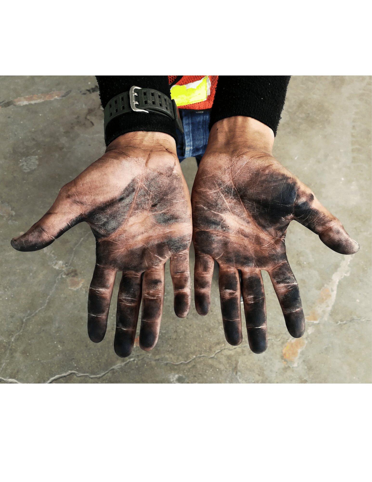 The dirty hands of a tradesperson after a long day.