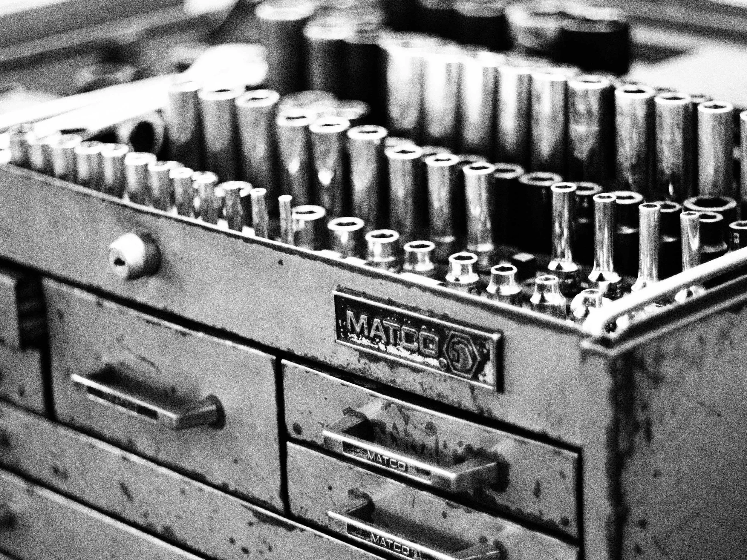 A black and white photo of some well used tools
