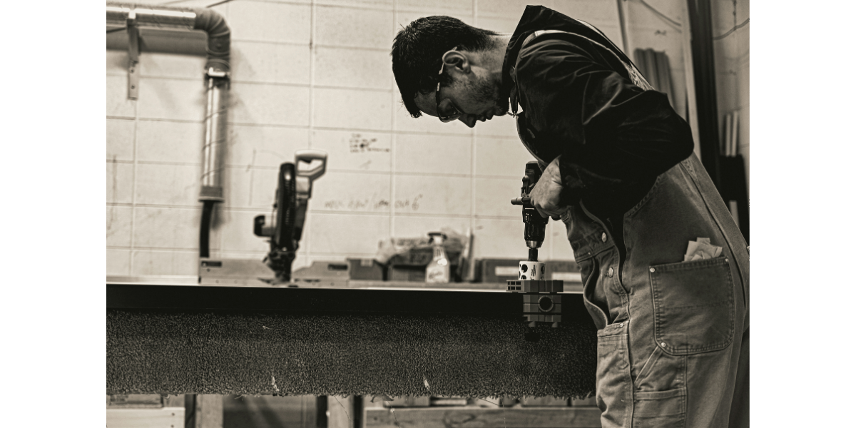 A black and white shot of a tradesperson.