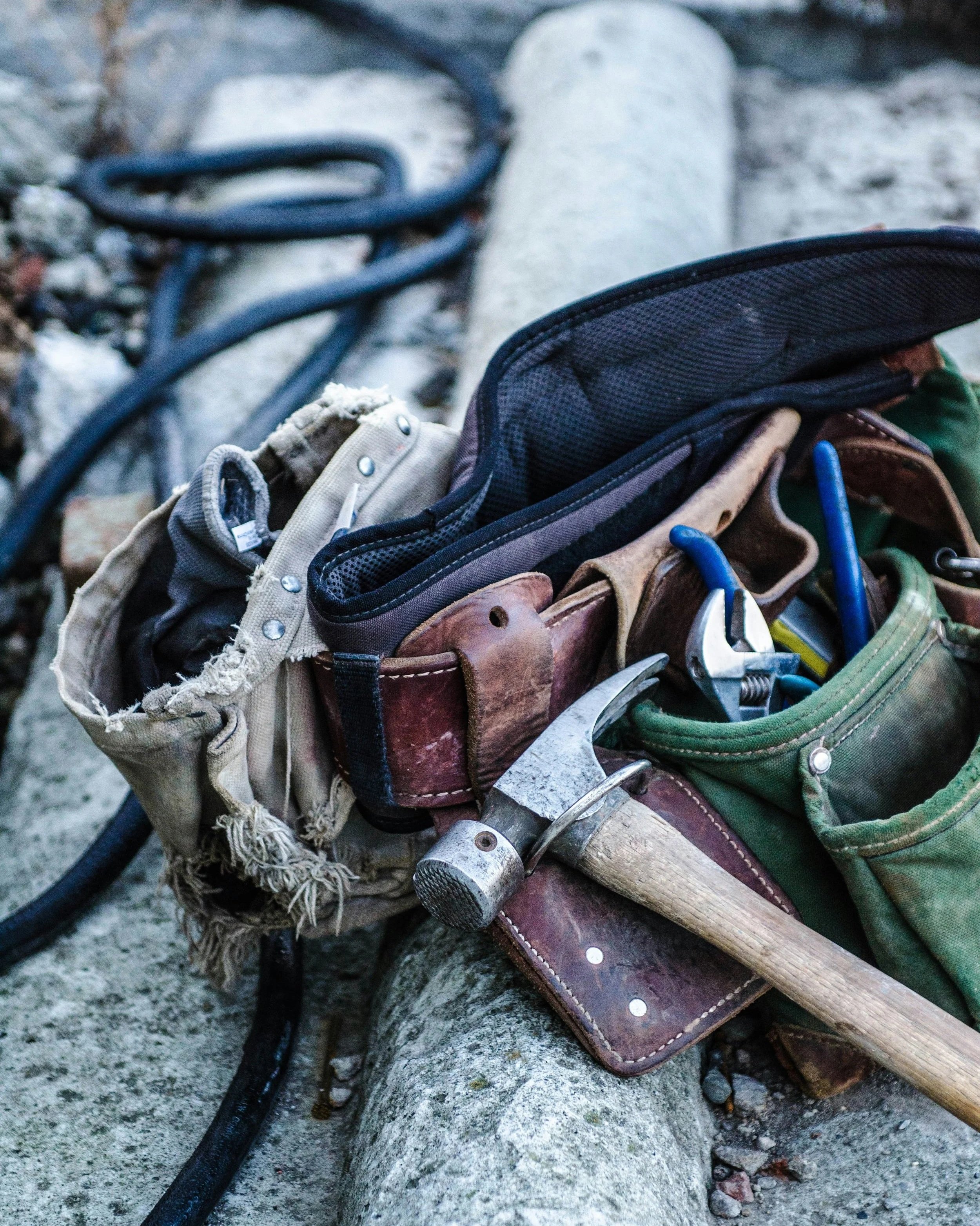 Image of an expert carpenters tool belt filled with tools.