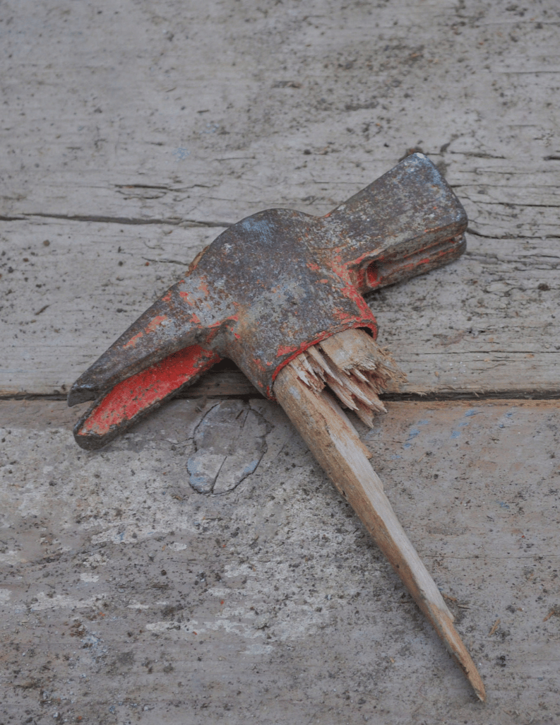 Image of a broken hammer/tool.