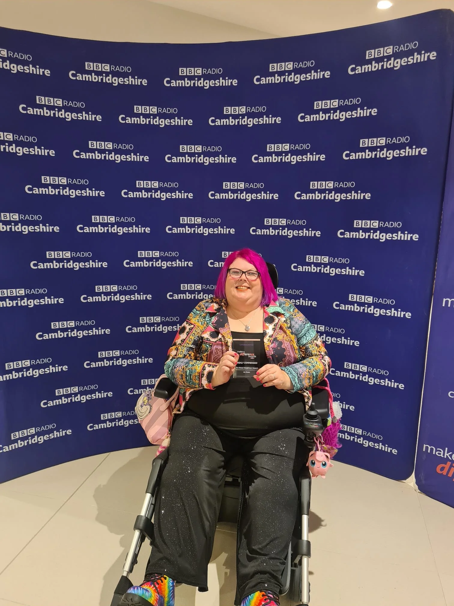 Holding my finalist award in front of the press area