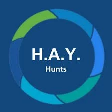 Logo for H.A.Y. Hunts, with a circular design in shades of blue and green.