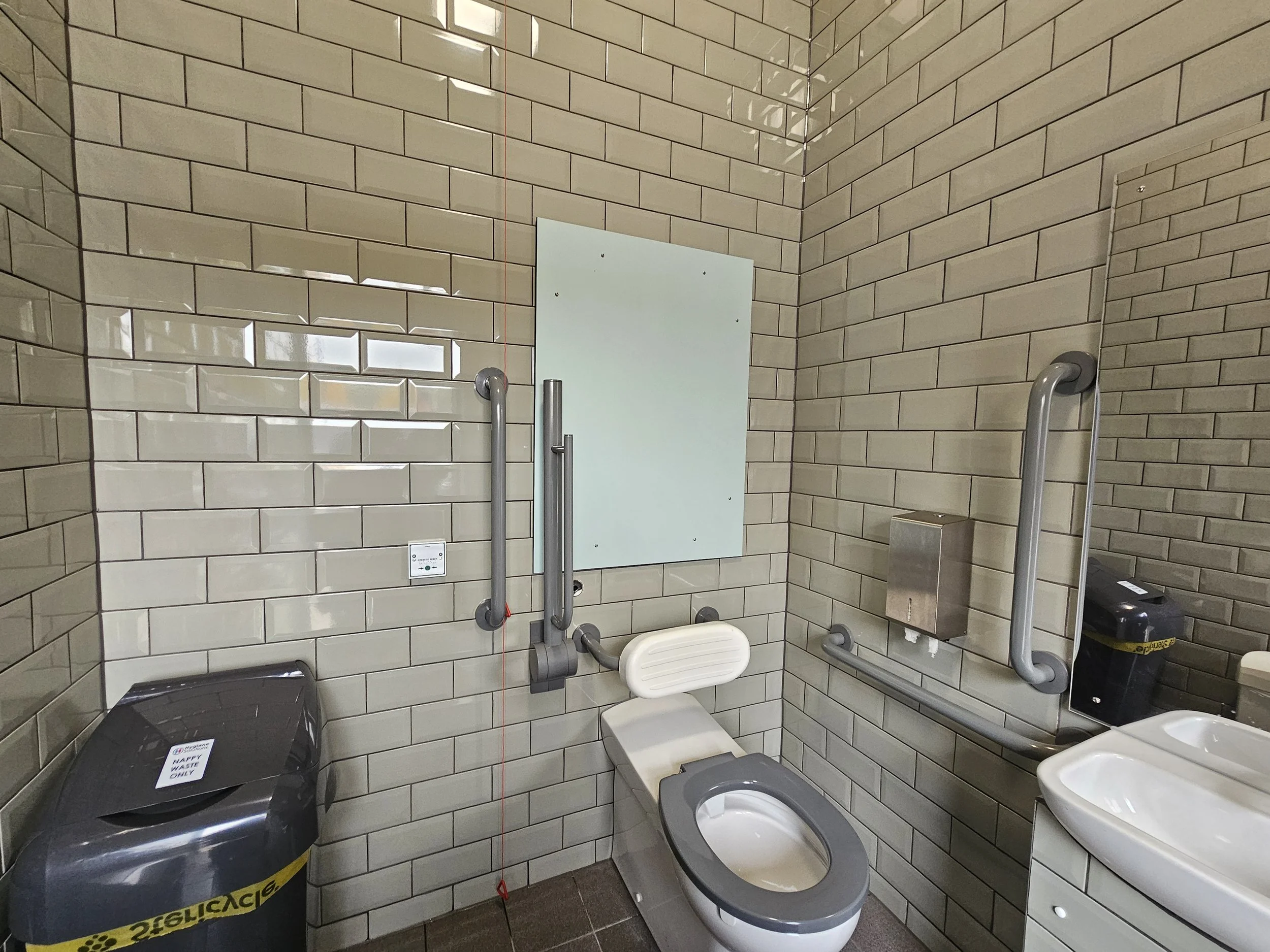 The disabled toilet is lighter, brighter, cleaner and better spaced out. (The bin has since been moved!)