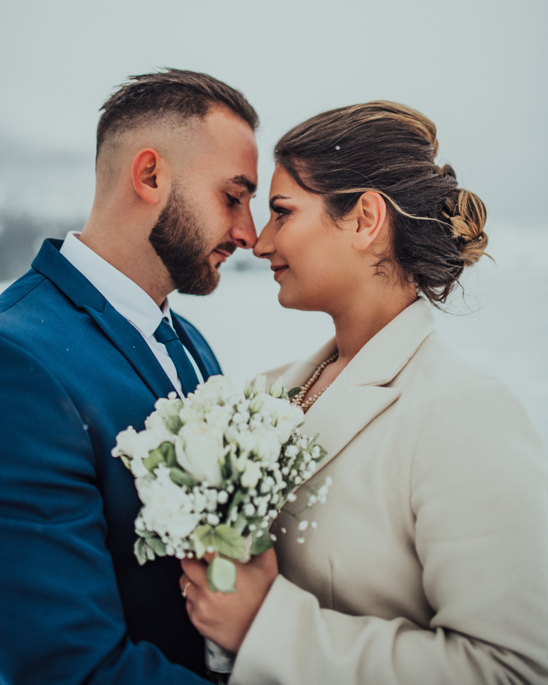 Intimate beach wedding moment with couple celebrating together