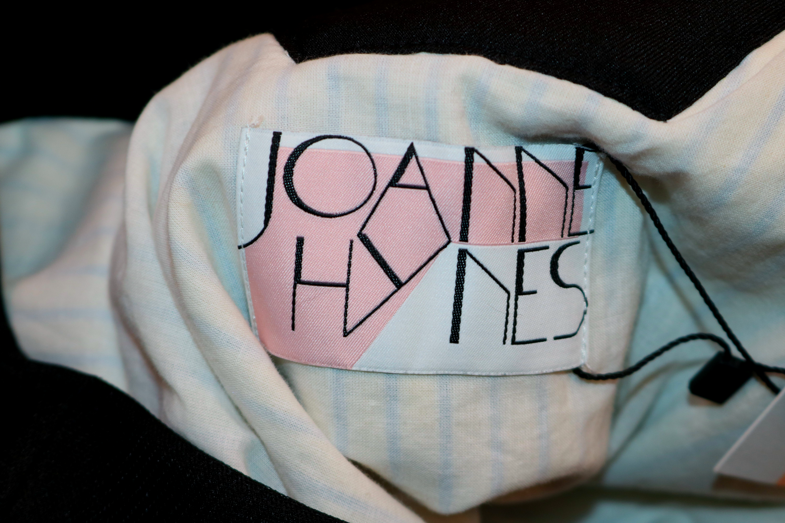 close-up of the interior woven joanne hynes label stitched cleanly below the neckline, featuring the signature typography layout and the dreamers collection naming.