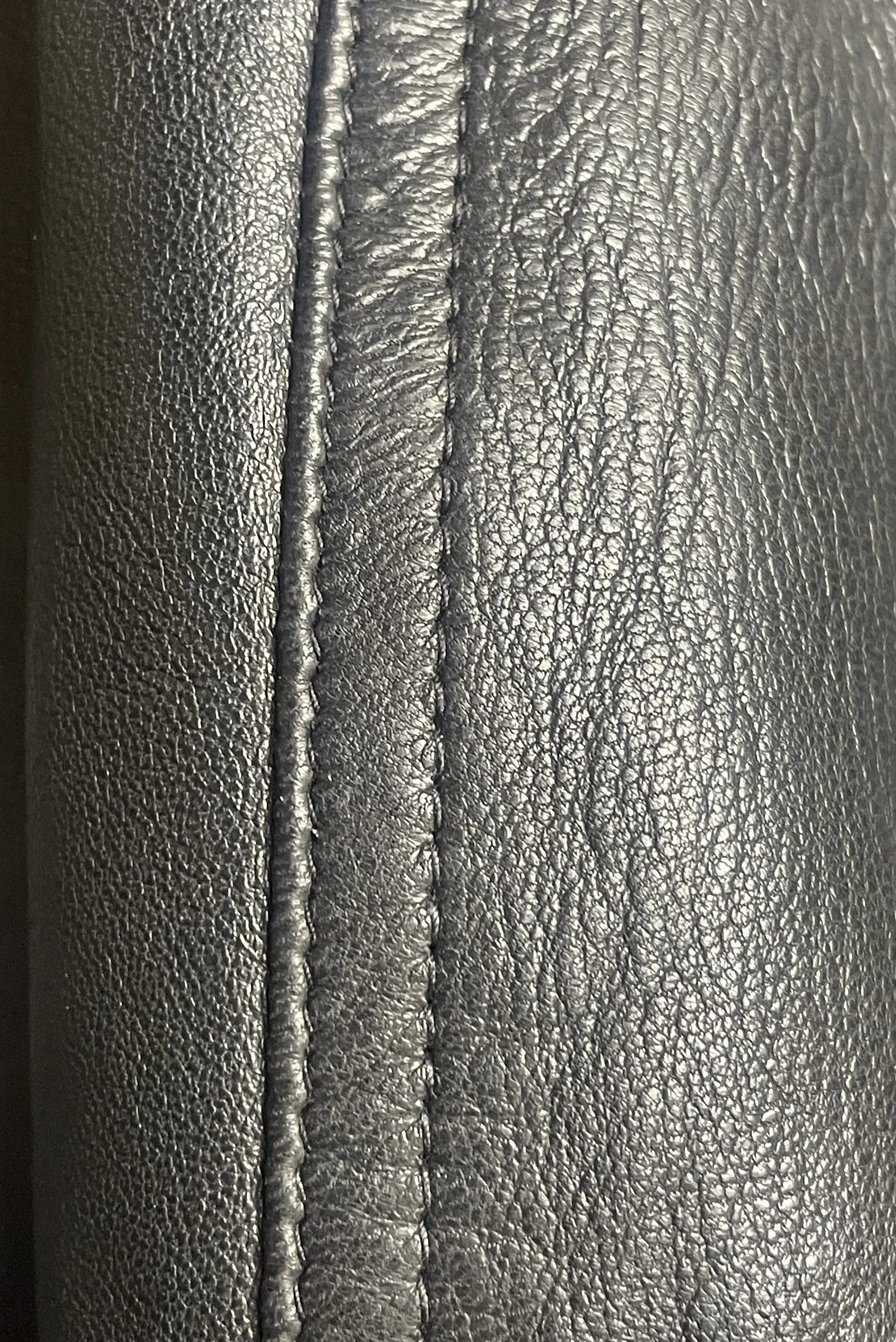 Close‑up of the seam stitching showing grain texture, edge finish, and construction quality.