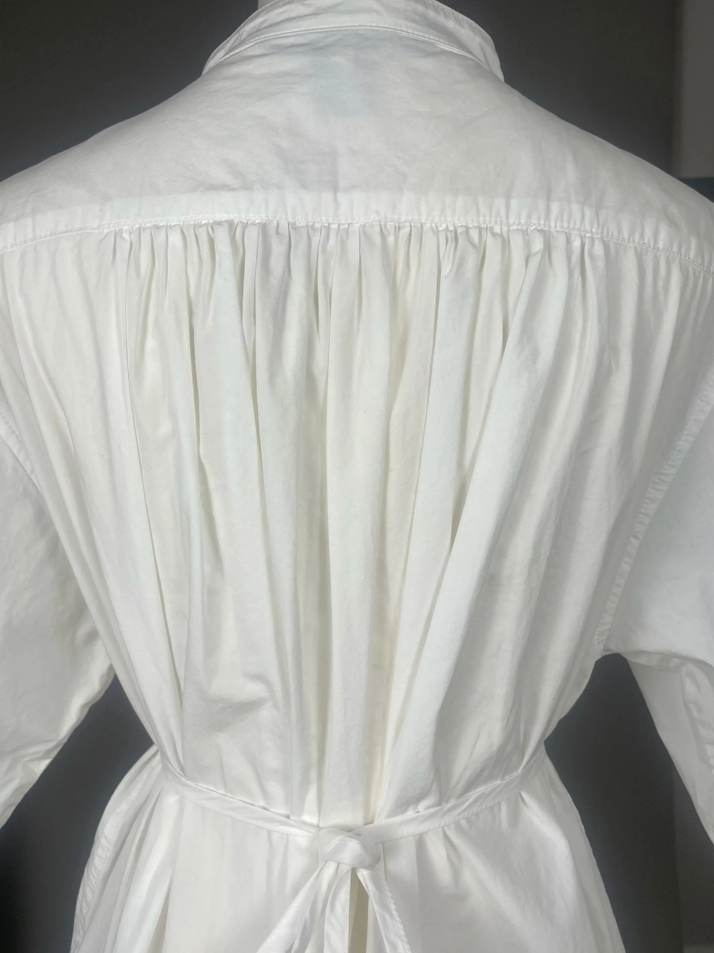 Close‑up of the back gathering showing the cotton texture, stitched structure, and soft volume.