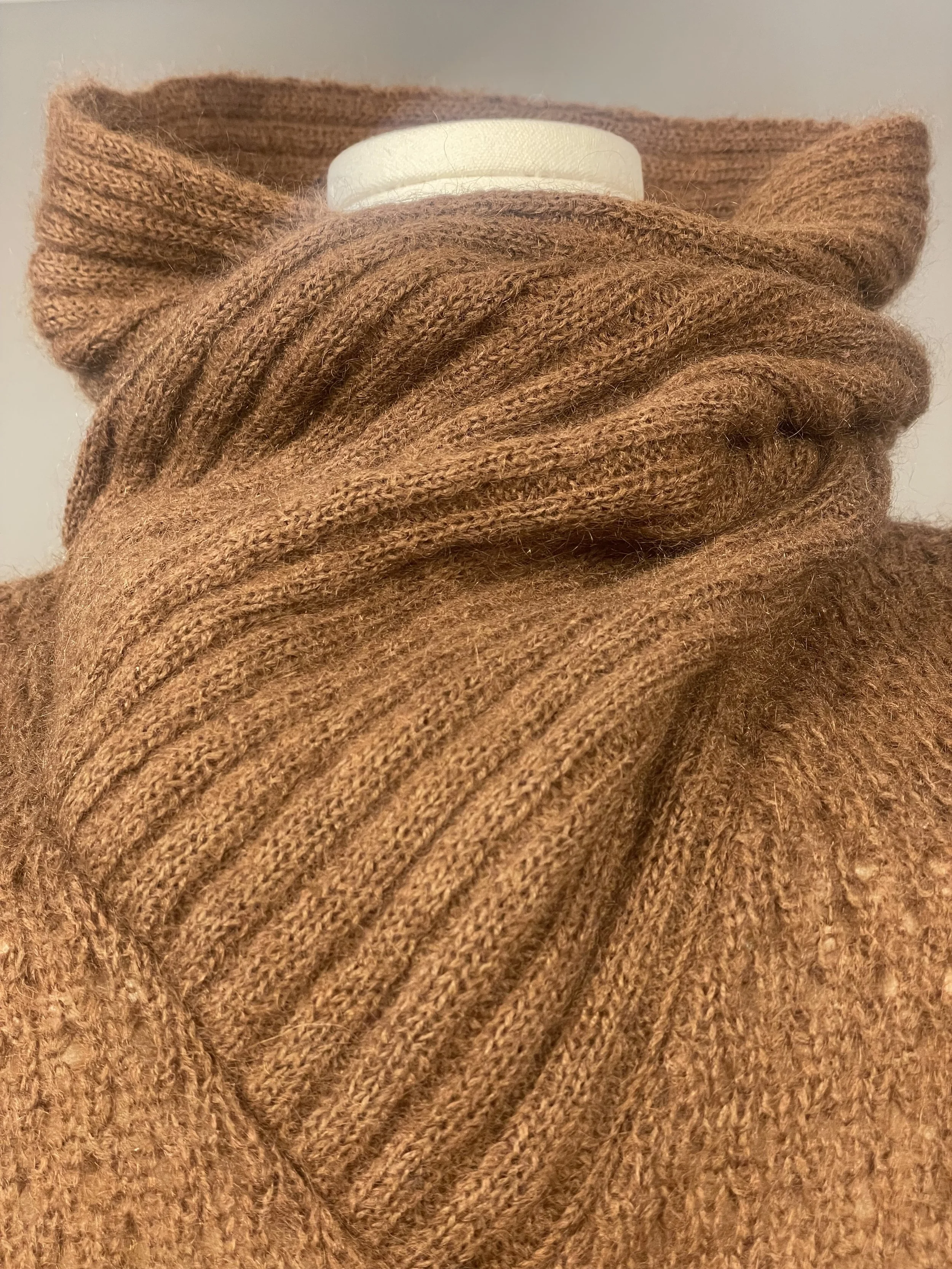 light golden brown close up of anne klein knit mohair cowl neck on dress form