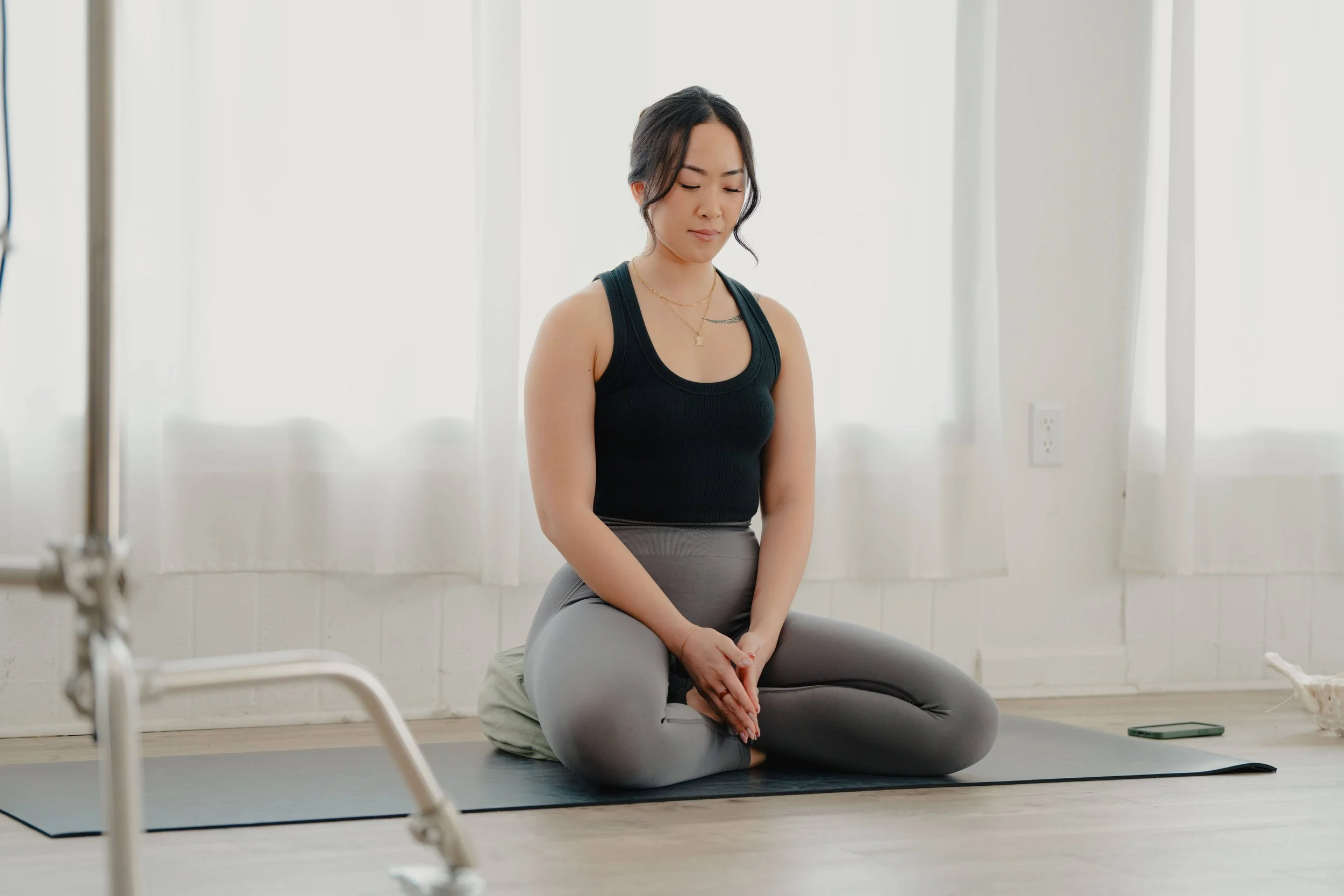 Restorative reiki teacher Jamee Leann Vasquez meditates in San Jose, California.
