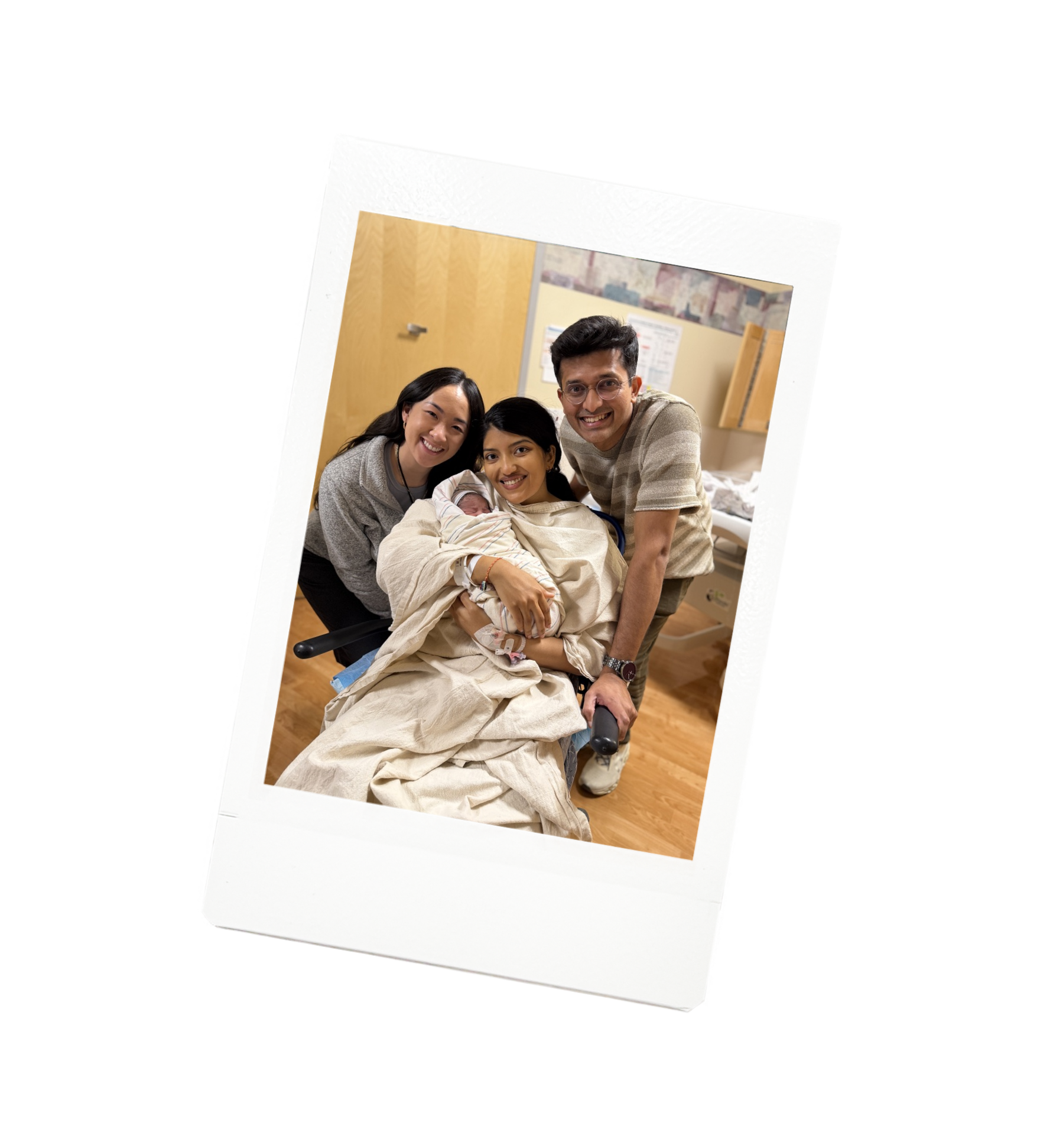 Flourish & Flow birth doula Jamee Leann Vasquez smiles with her clients and their newborn baby in a hospital room.
