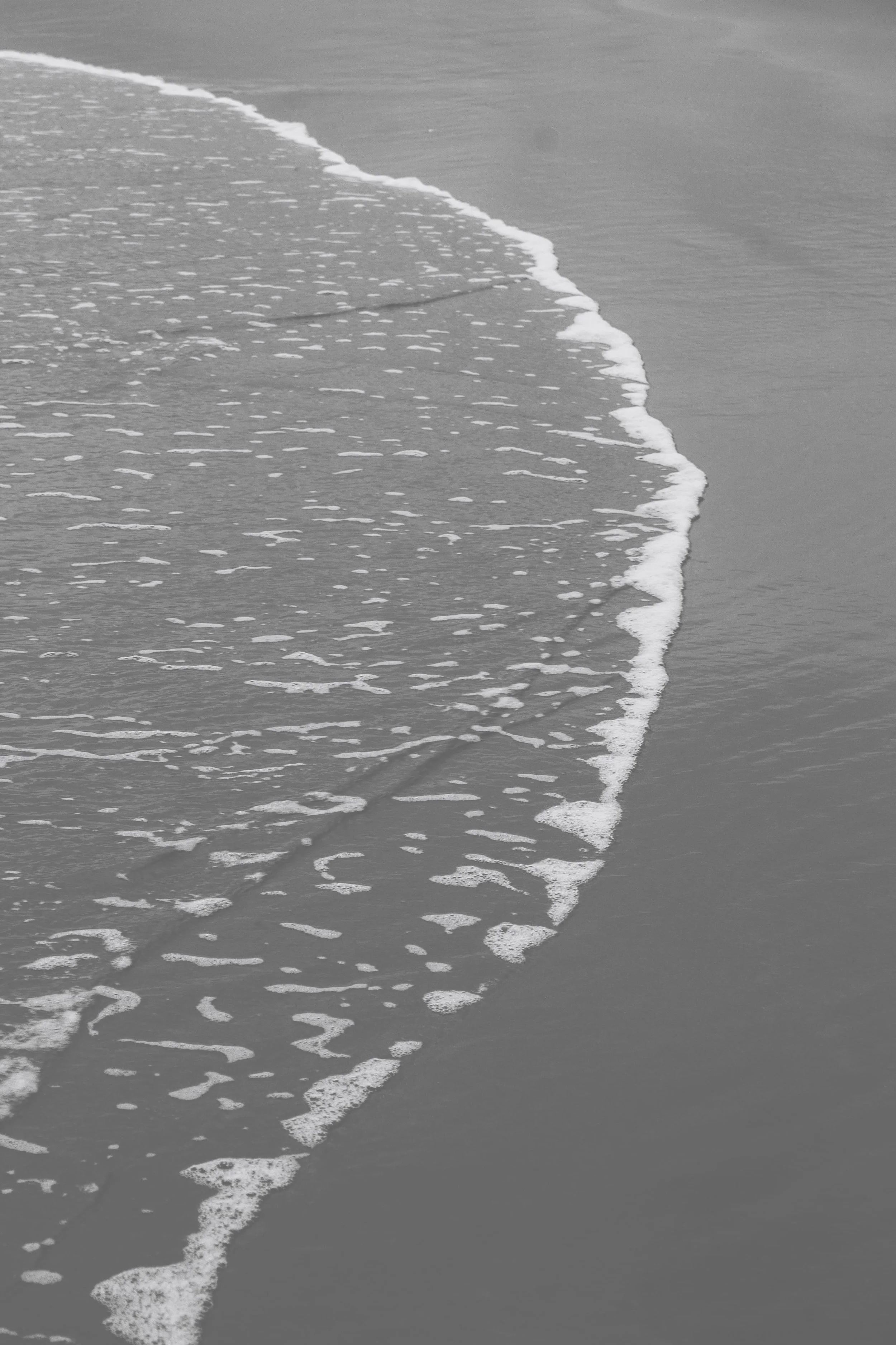 The tide recedes from the sand on a Santa Clara beach.