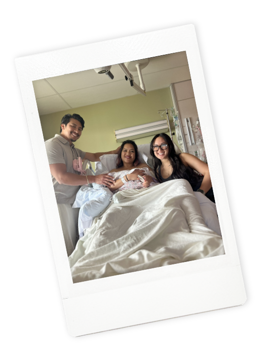 Birth doula Jamee Leann Vasquez smiles with her clients as they prepare for birth in a Santa Clara hospital room.