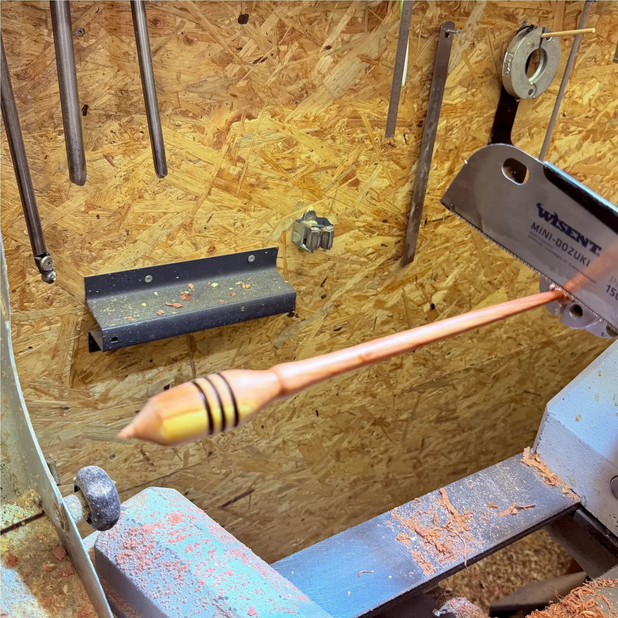 Hand turning an Austrian juniper support spindle in a small woodworking workshop near Linz, Austria