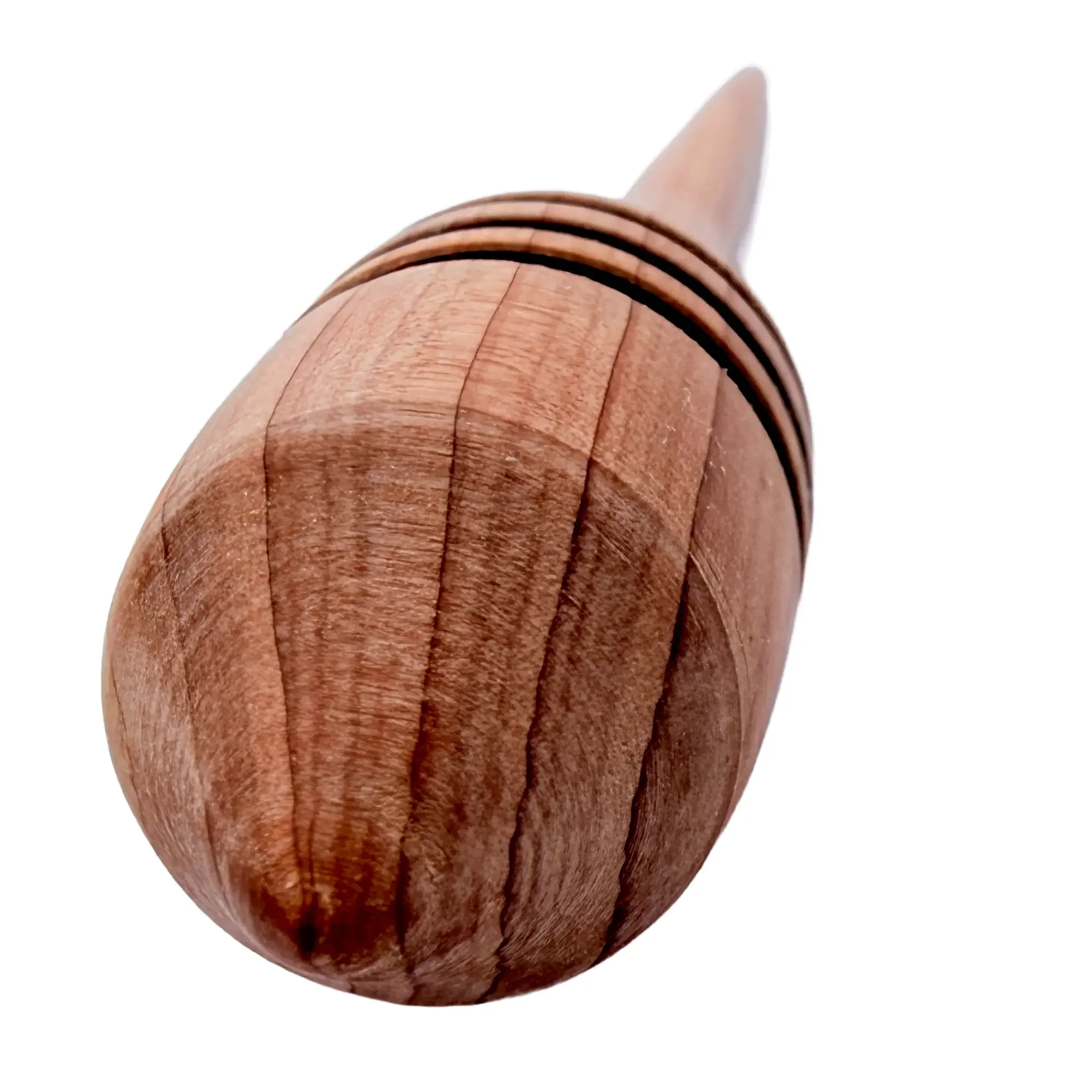Close-up of hand turned Austrian juniper wood showing warm grain patterns and craftsmanship.
