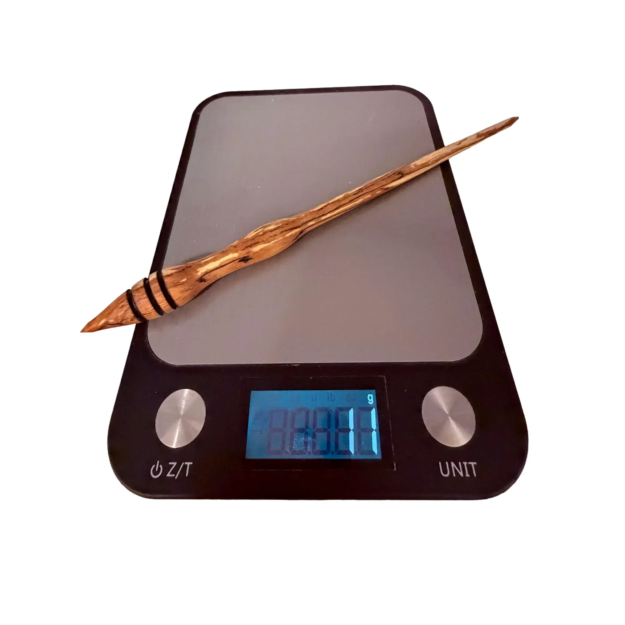 Ultra lightweight Austrian apple wood support spindle showing exact weight of 11 grams on a digital scale.