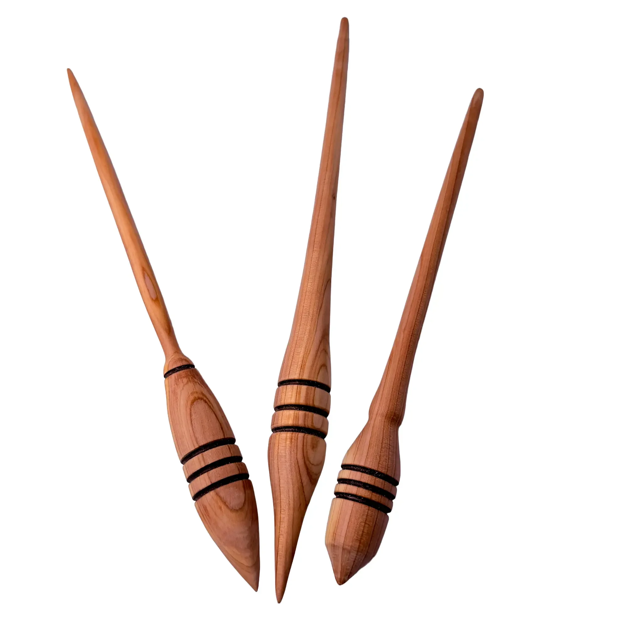 Multiple views of a one-of-a-kind Austrian juniper support spindle handcrafted in Austria.