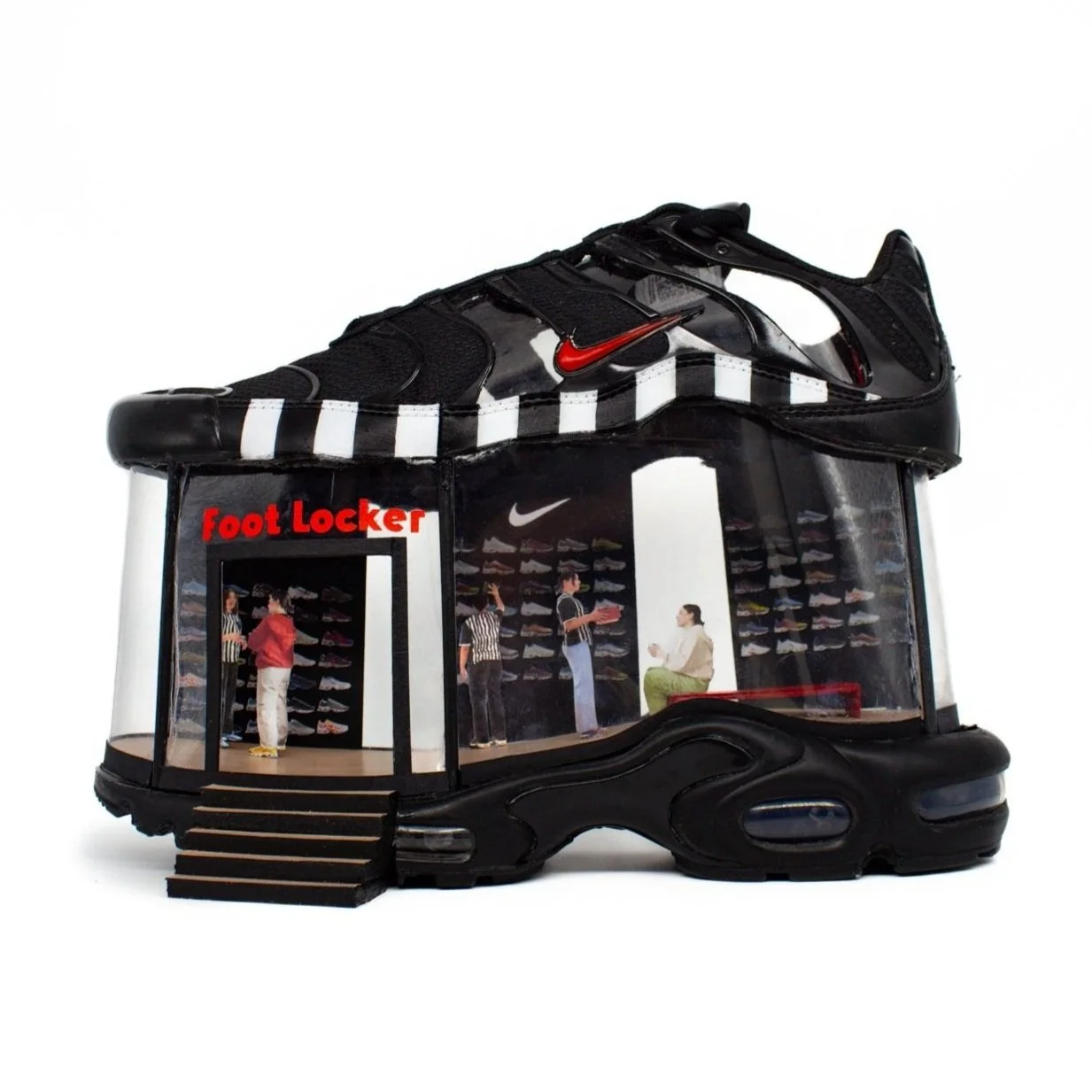 Shoe designed in collaboration with Foot Locker. Transformed into a store with miniature people inside.