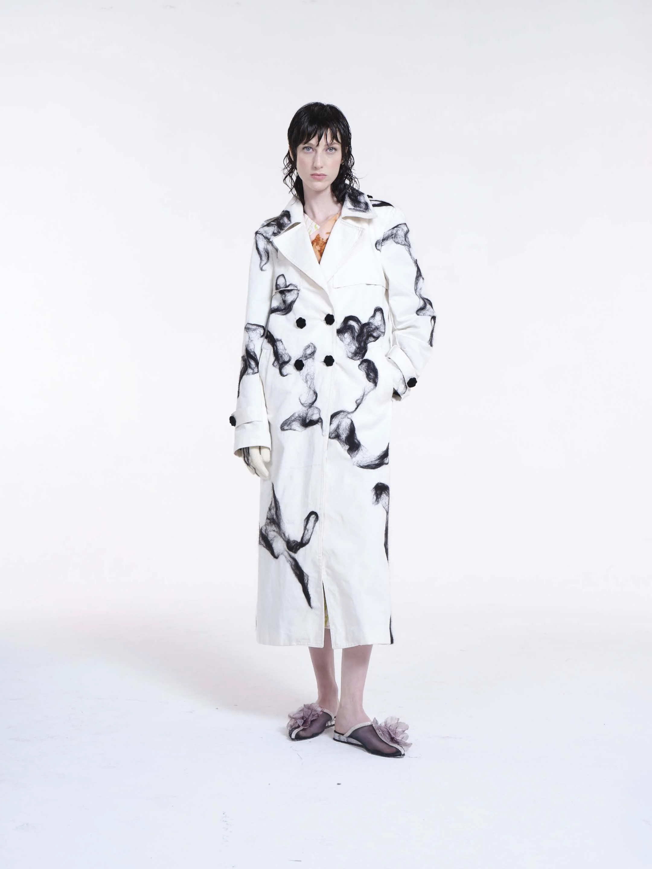 Mudlark Trench Coat by Clara Pinto – three quarter view showing full length and organic black wool embellishment pattern