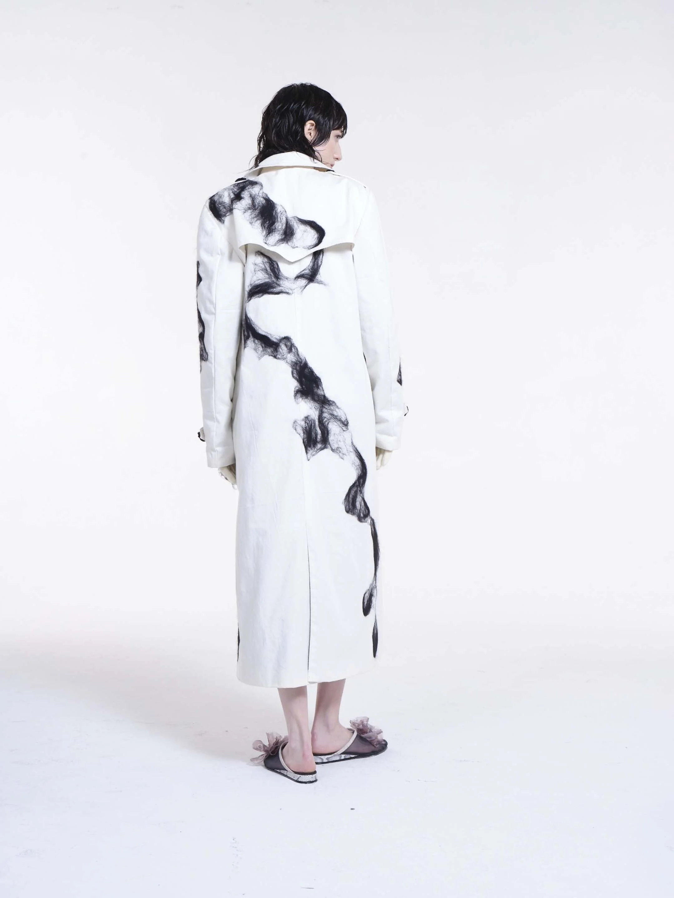 Mudlark Trench Coat by Clara Pinto – back view showing back slit and painterly black wool pattern on off-white cotton