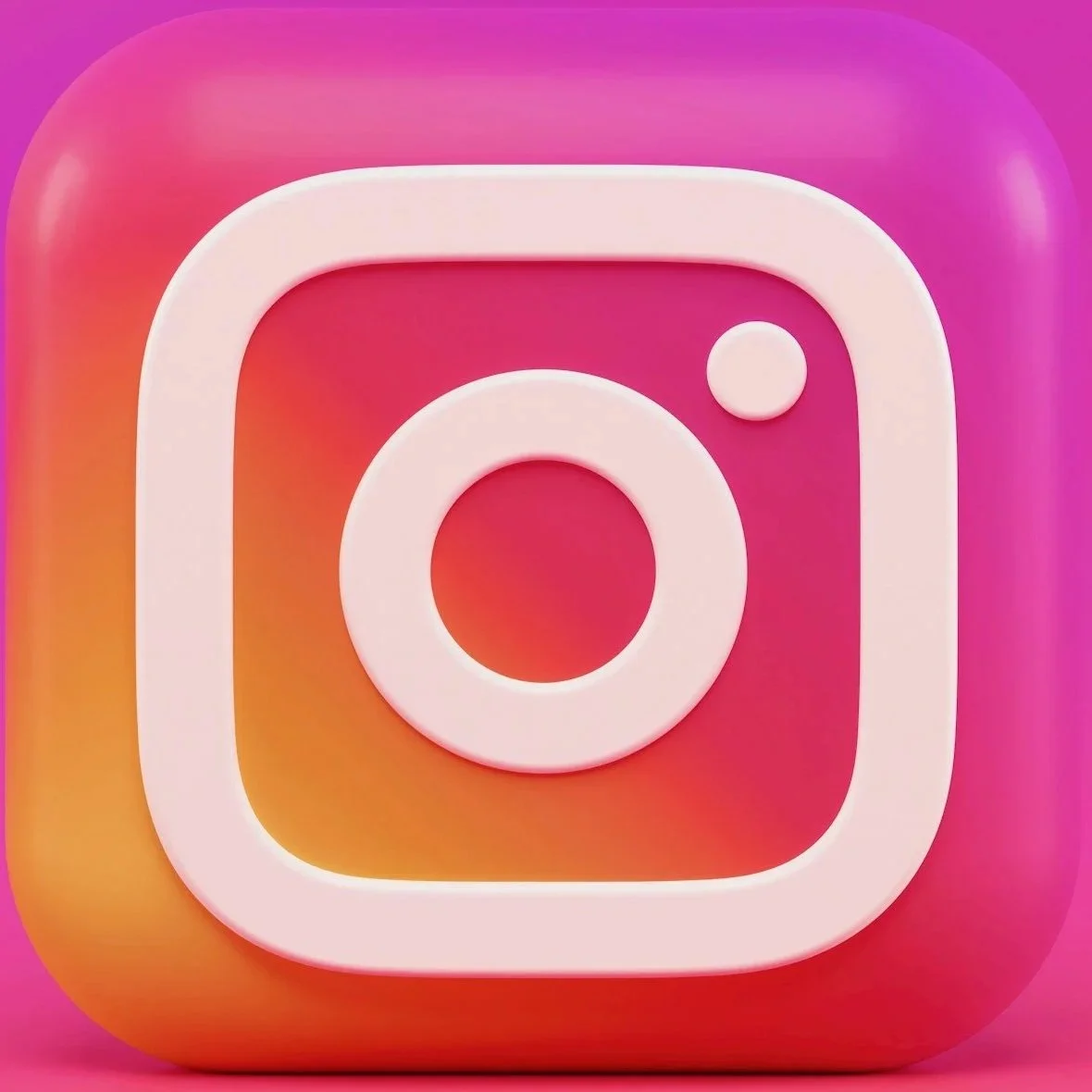 Close-up of the Instagram app icon with a pink, orange, and purple gradient background and a white camera outline.