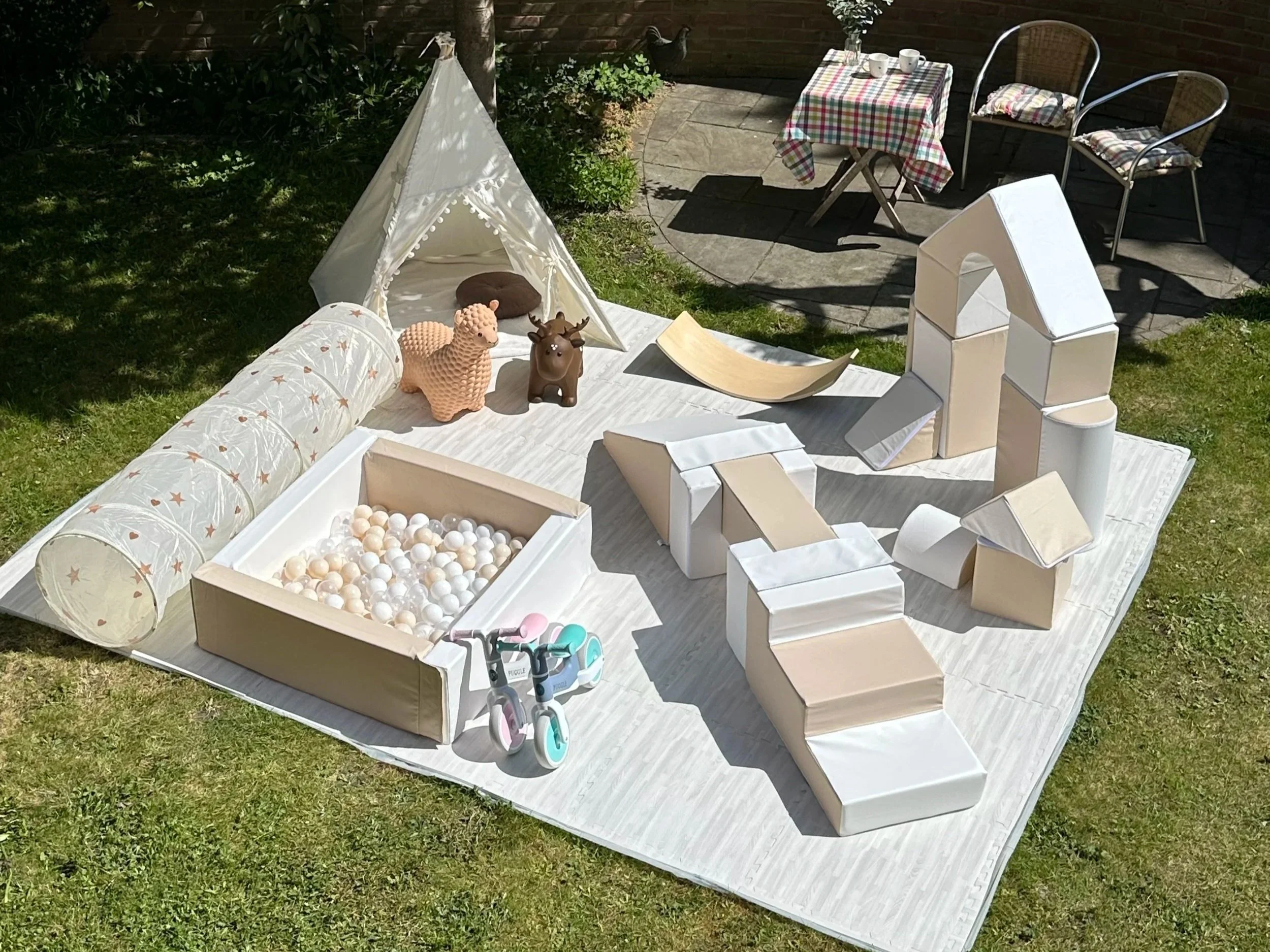 Photo showcases the Big Adventure Package equipment in a sunny garden