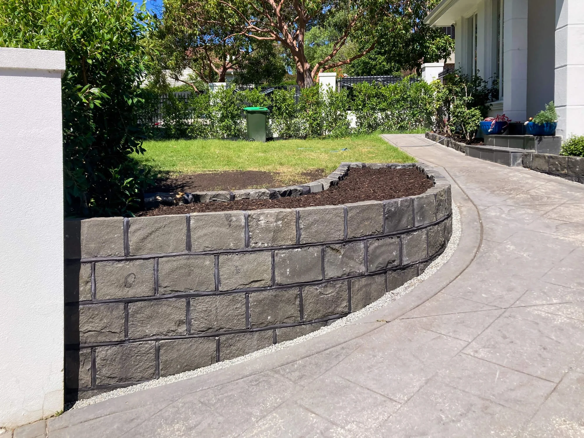 Splitface bluestone retaining wall replacement