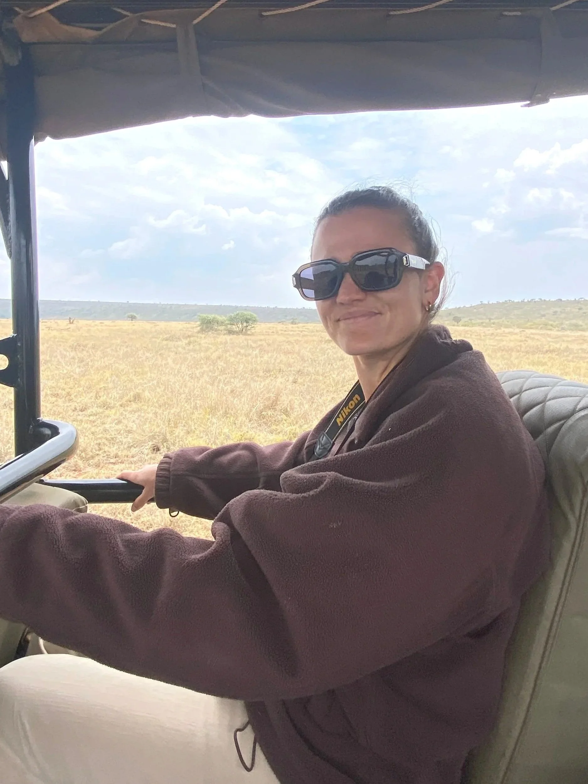 Georgie smiling on a game drive in Laikipia, Northern Kenya