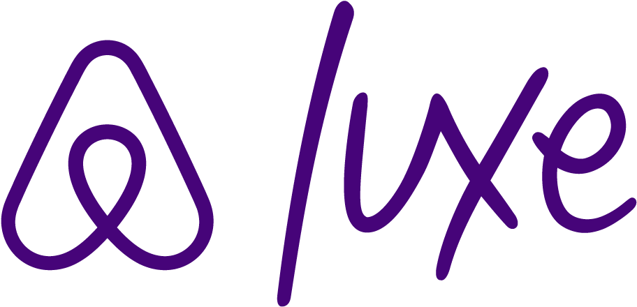 Airbnb Luxe logo in purple cursive font