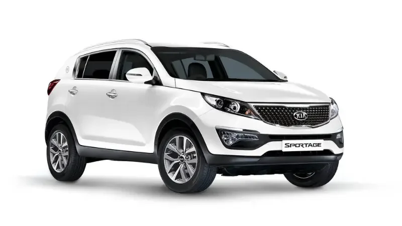 White Kia Sportage SUV with black accents and alloy wheels, positioned on a plain white background.