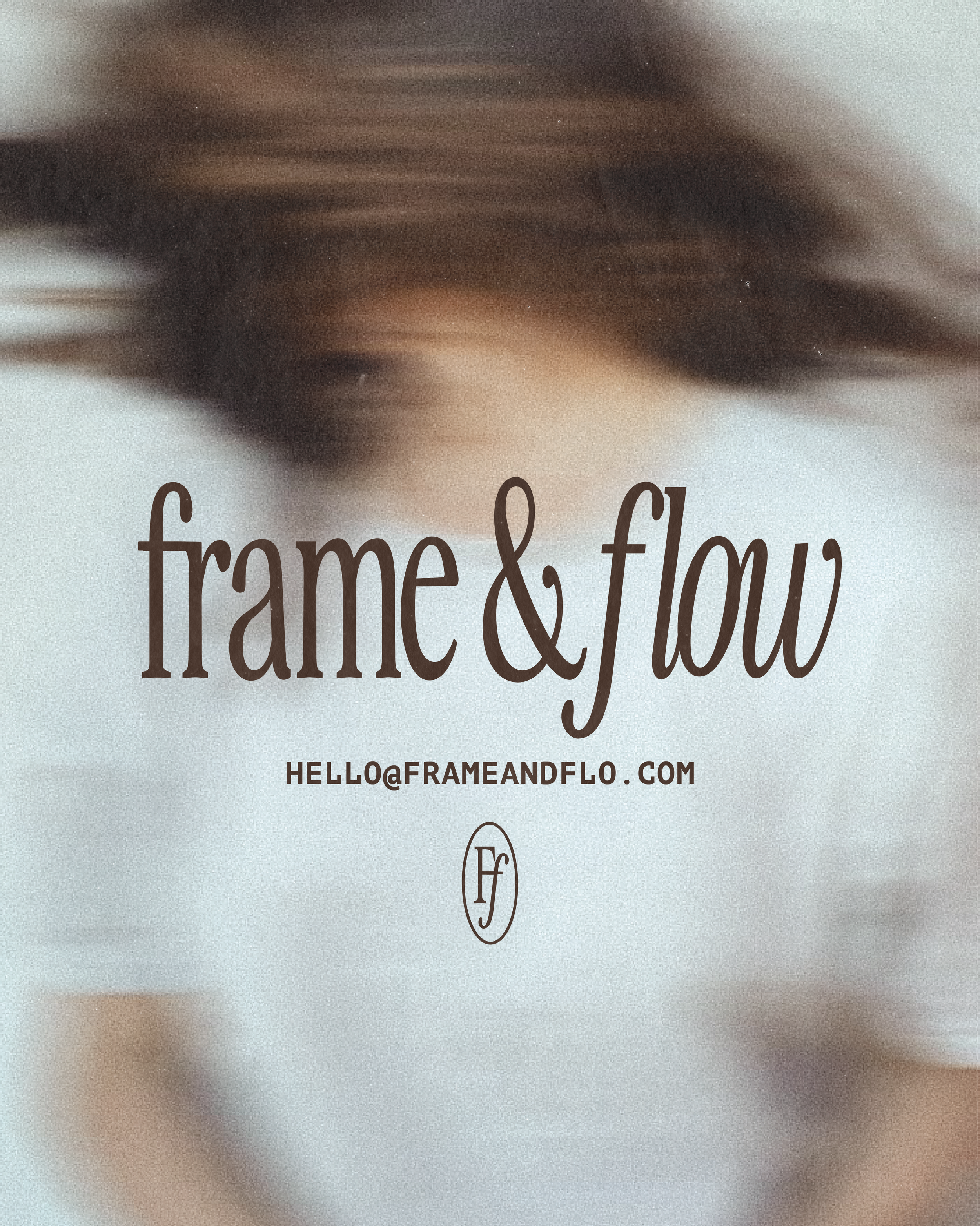 Close-up of a book cover with text that reads 'from & flow'. The background is a blurred image of a person's face with brown hair and eyes, and an email address hello@frameandflo.com.