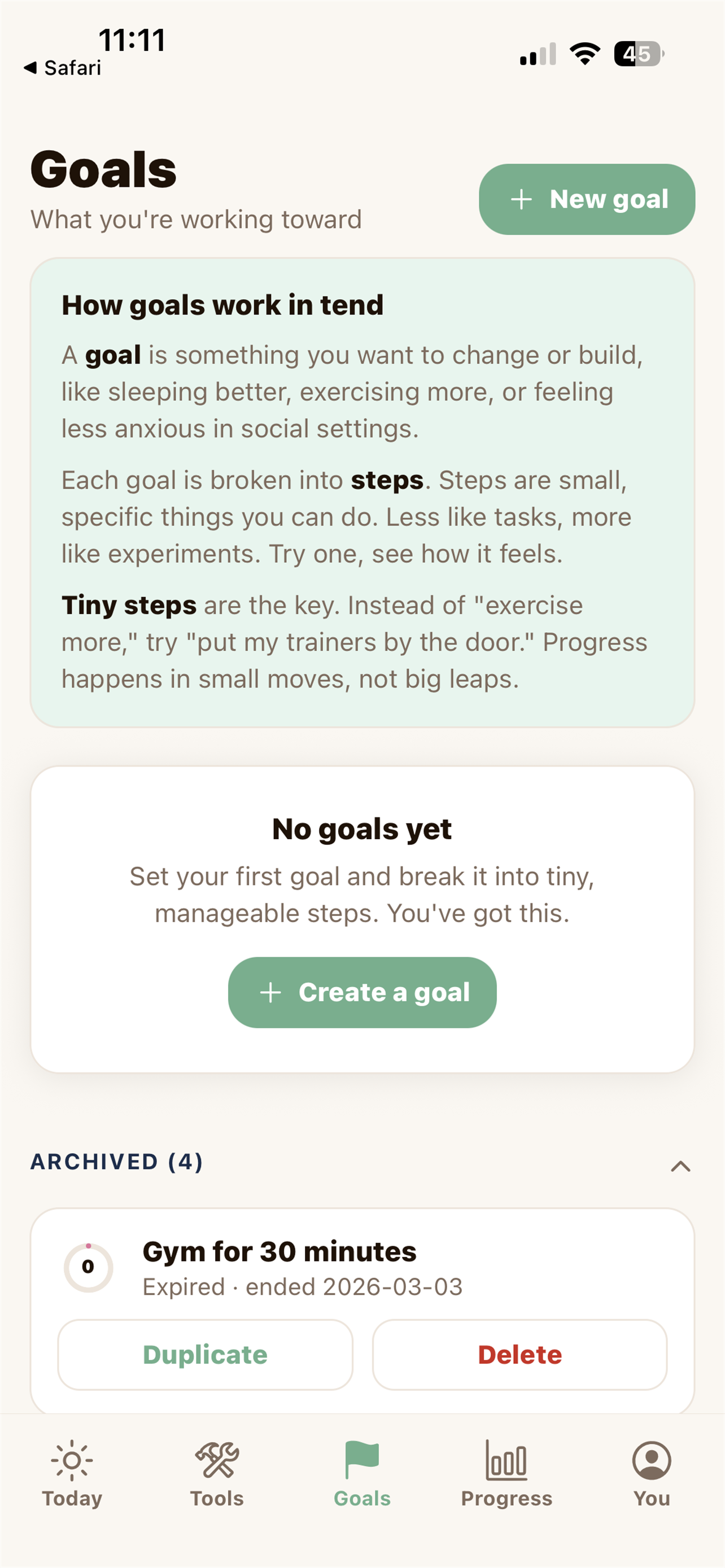 Mobile app screen showing a goals section with options to create a new goal or a new goal, with instructions on how goals work, and an archived goal for gym time. Navigation bar at the bottom includes Today, Tools, Goals, Progress, and You.