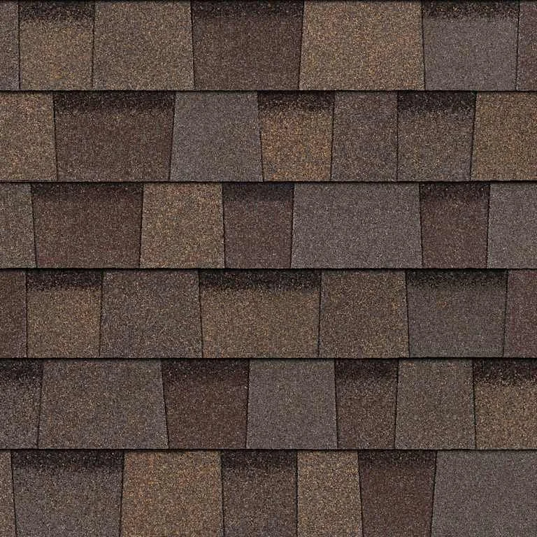 Close-up of brown asphalt roofing shingles arranged in horizontal rows.