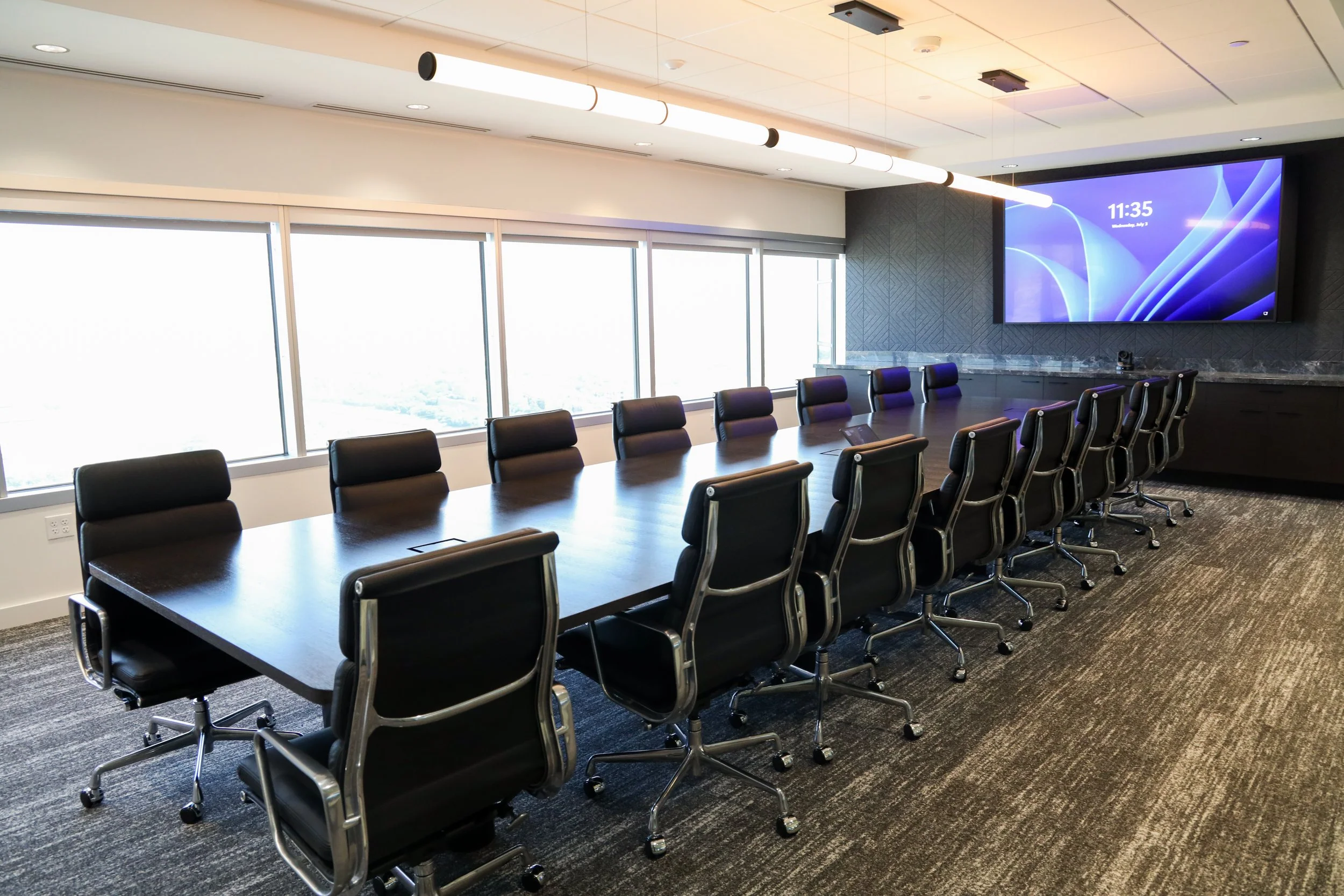 large conference room with Eames padded chairs