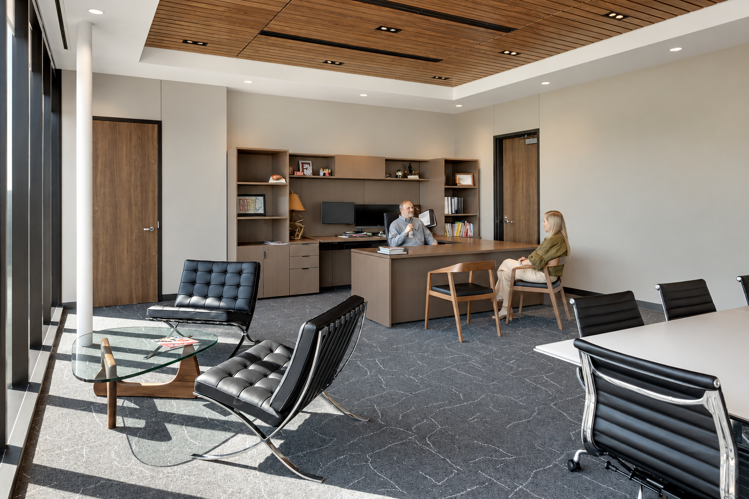 Modern Northwest ISD executive office furnished by WRG, featuring private workspaces, lounge seating, and a collaborative meeting area.