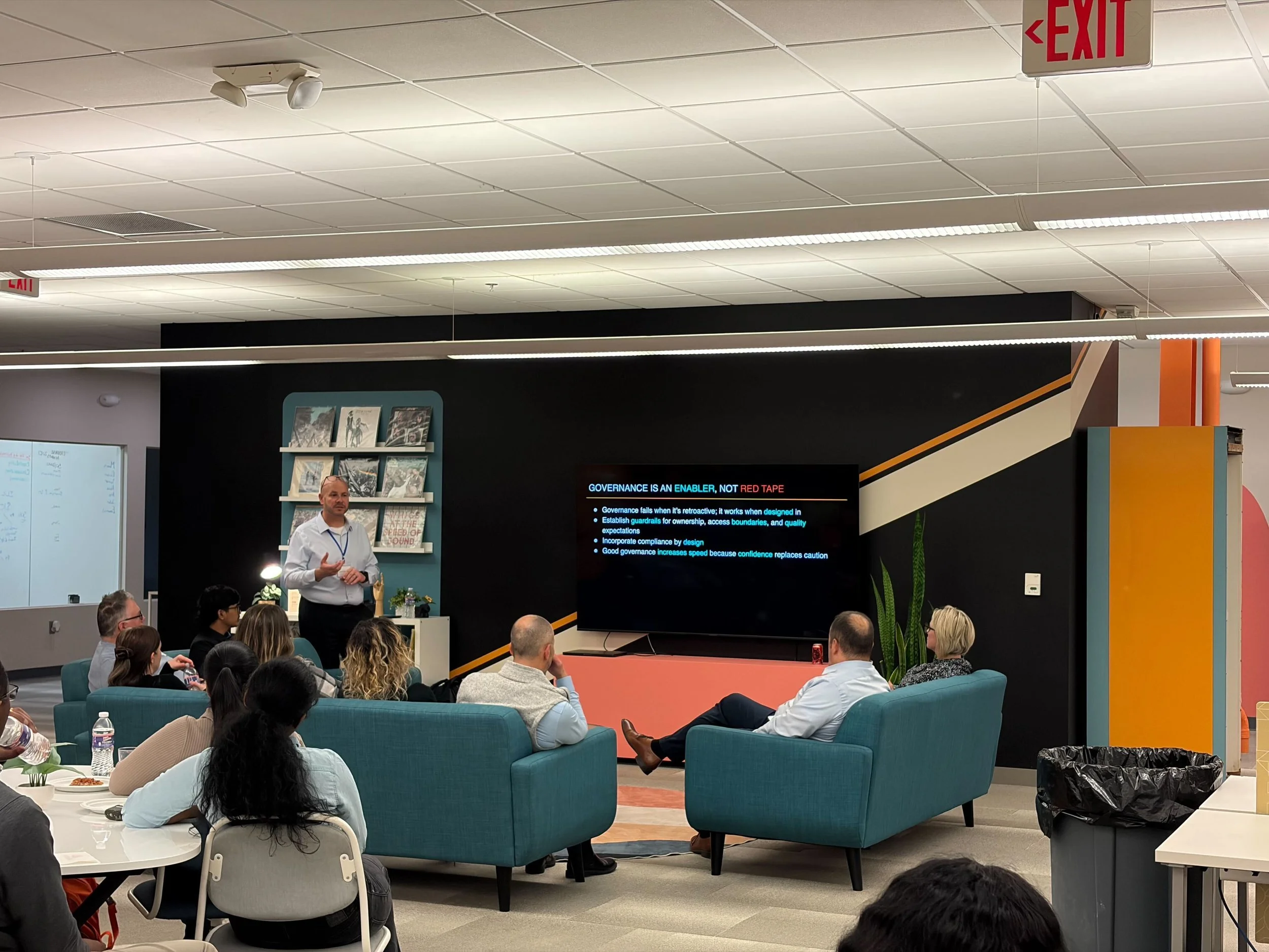 person giving a presentation while others watch
