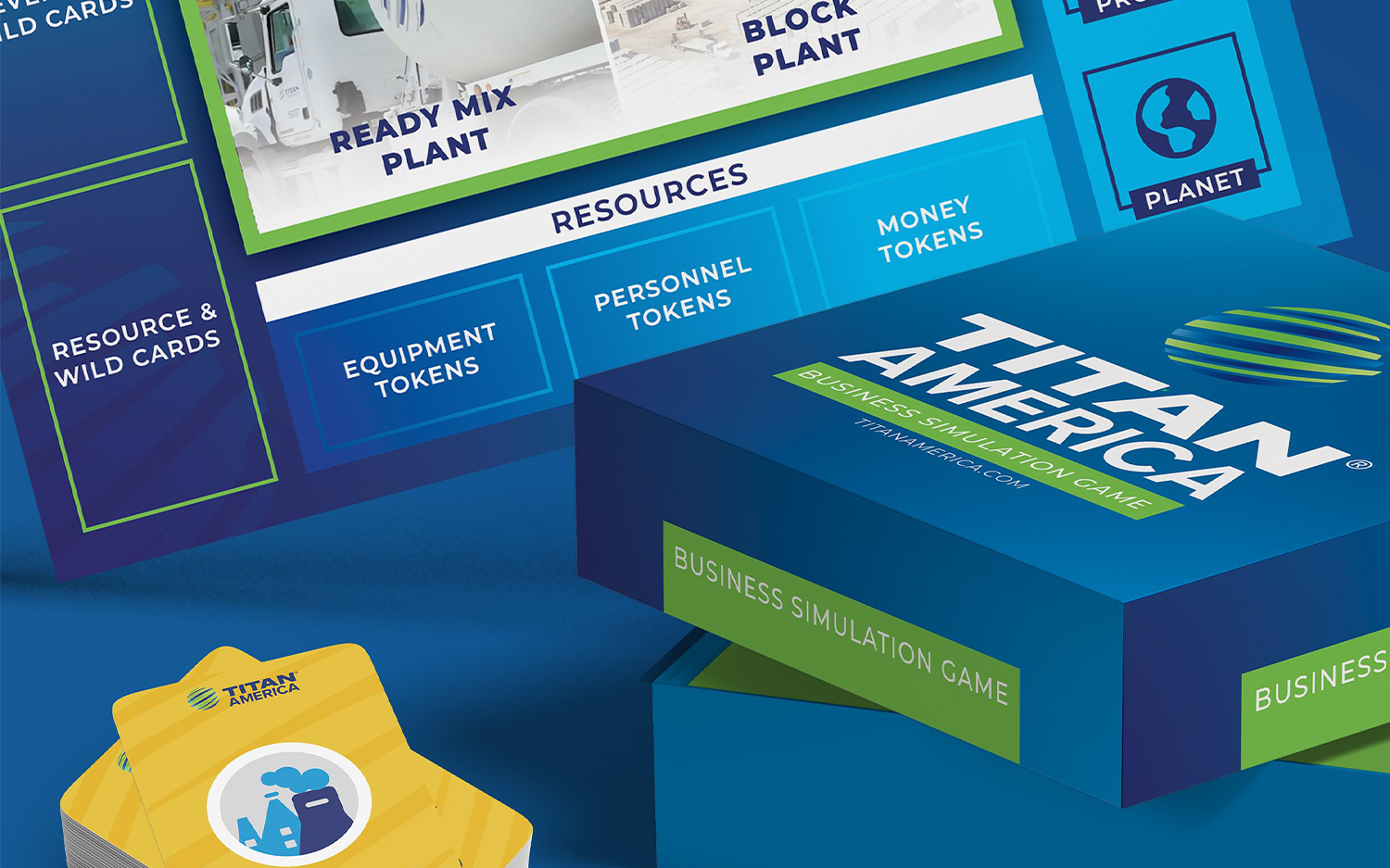Close-up of the board game Titan America, showing resource and token options including equipment, personnel, and money tokens, with the game's box prominently displayed.