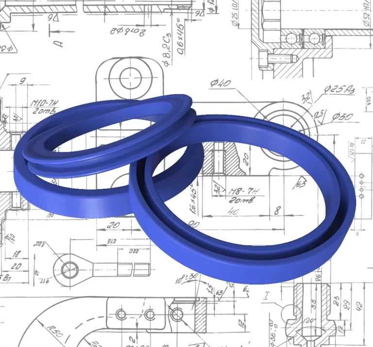 Three blue rubber seals or O-rings placed on top of engineering mechanical drawings with technical measurements and detailed diagrams.