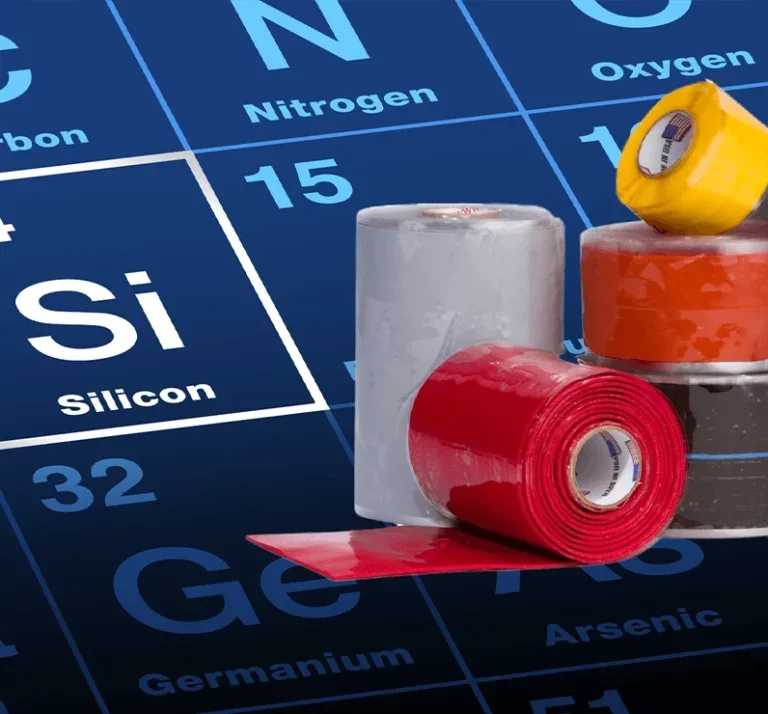 Rolls of electrical tape on a section of the periodic table showing symbols for Silicon and Germanium.